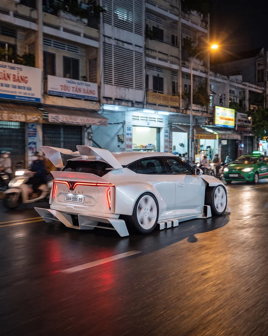 White VF7 Widebody driving at night, rear view, AI render